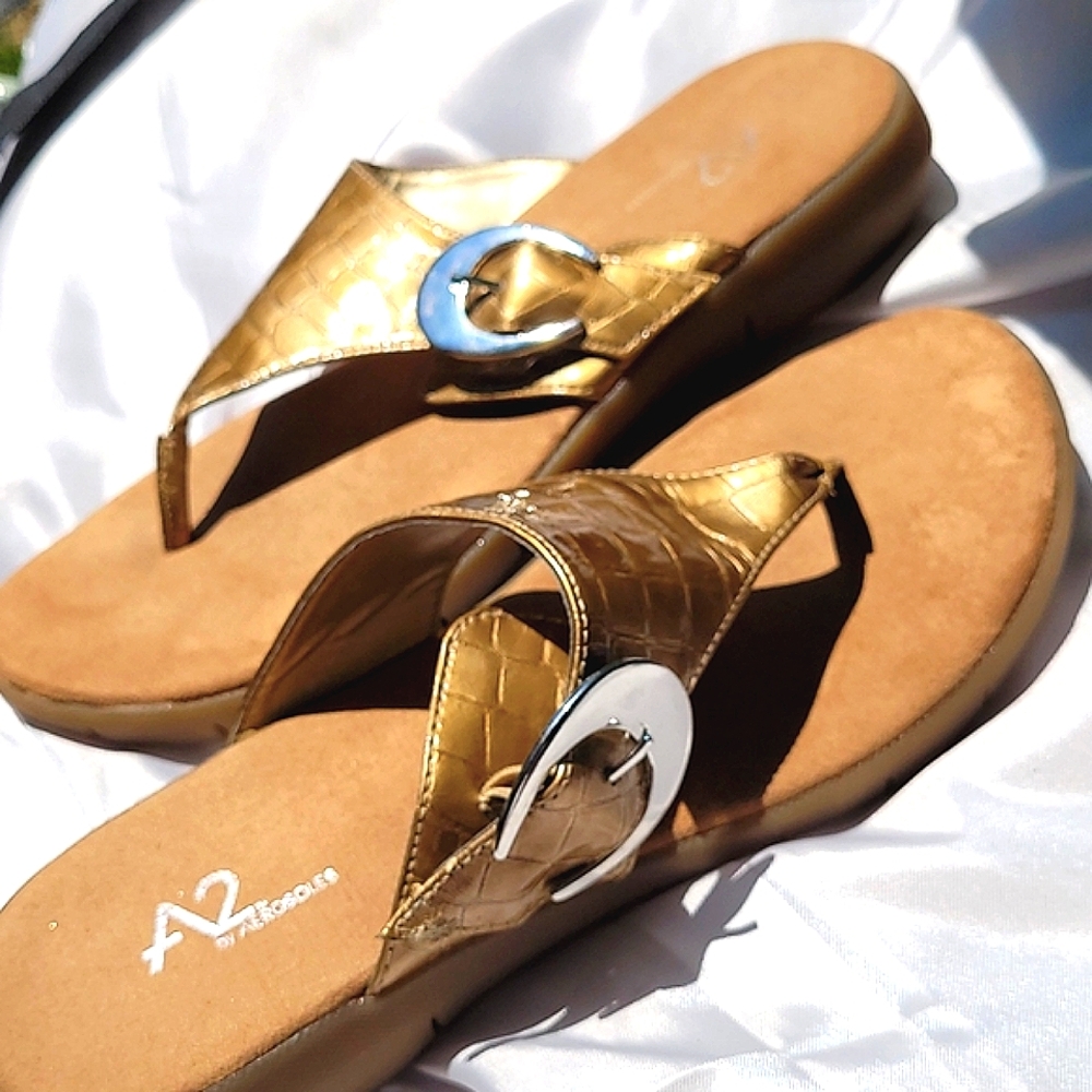 Aerosoles A2 sandal slides.. Gold color leather upper.. side adjustable buckle